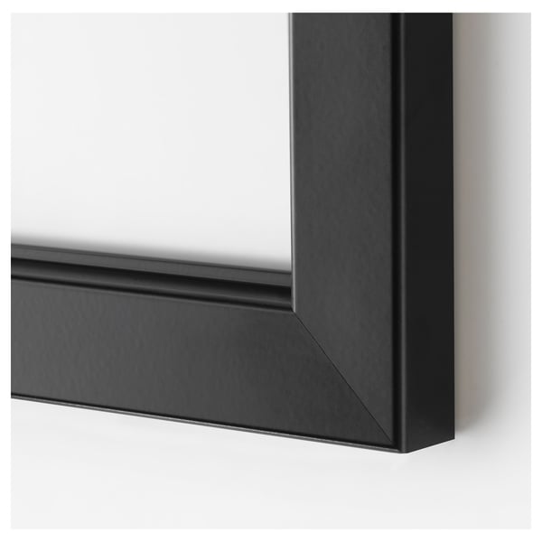 Black rectangular picture frame close-up, showing sleek design and clean edges.