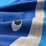 Soft blue duvet cover with a playful fish eye print, made from quality cotton and lyocell blend.