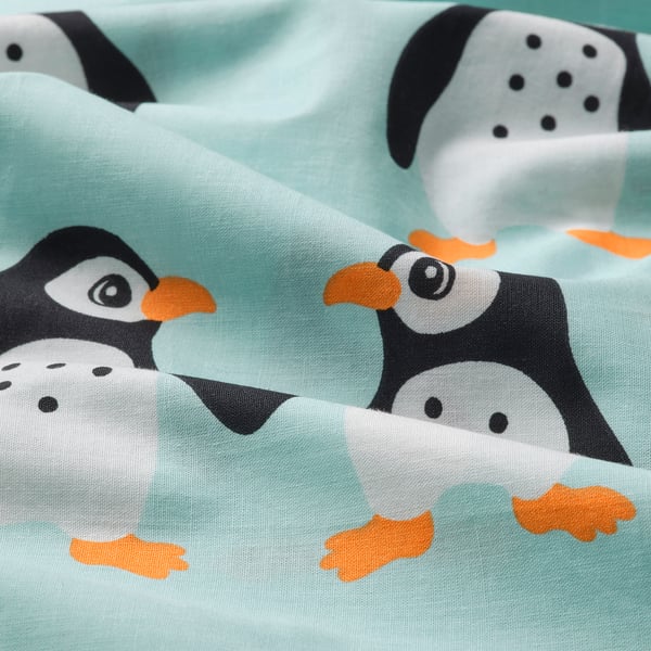Adorable penguin print duvet cover in soft minty fabric.