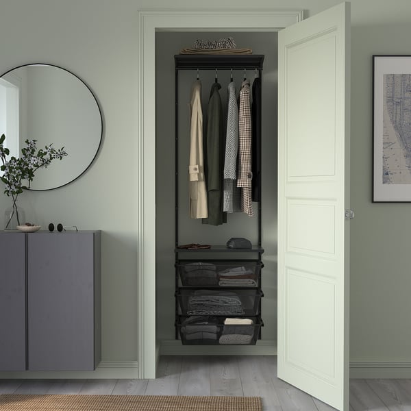 BOAXEL wall storage in small room, black with gray shelves, next to cabinet, mirror, picture.