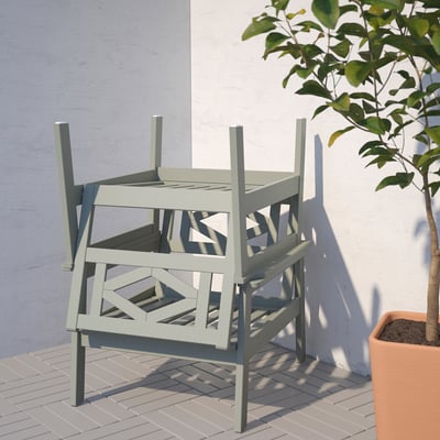 Stacked eucalyptus armchair, blue wall & plant