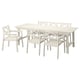 A BONDHOLMEN outdoor dining set in white with acacia wood and acrylic paint. It includes a rectangular table and six matching chairs.
