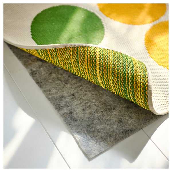 Colorful, durable rug with dots. Suitable for indoor/outdoor use. Stain-resistant and water-resistant.