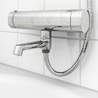 Image shows chrome shower mixer with attached hose. Safety stop at 38°c, cold touch for safety, and adjustable flow.