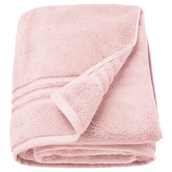 BROKGLIM light pink towel, soft organic cotton, folded neatly with a decorative border.