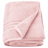 BROKGLIM light pink towel, soft organic cotton, folded neatly with a decorative border.