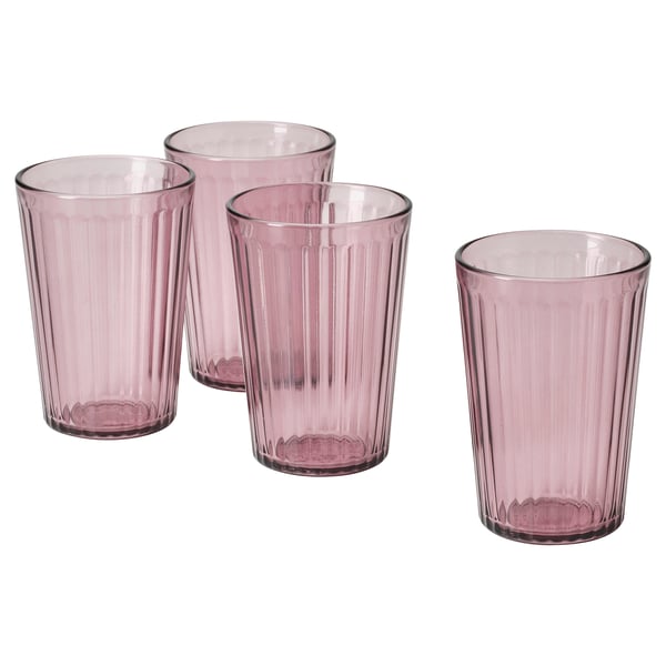 Four pink glass cups, ribbed design, set in a line.