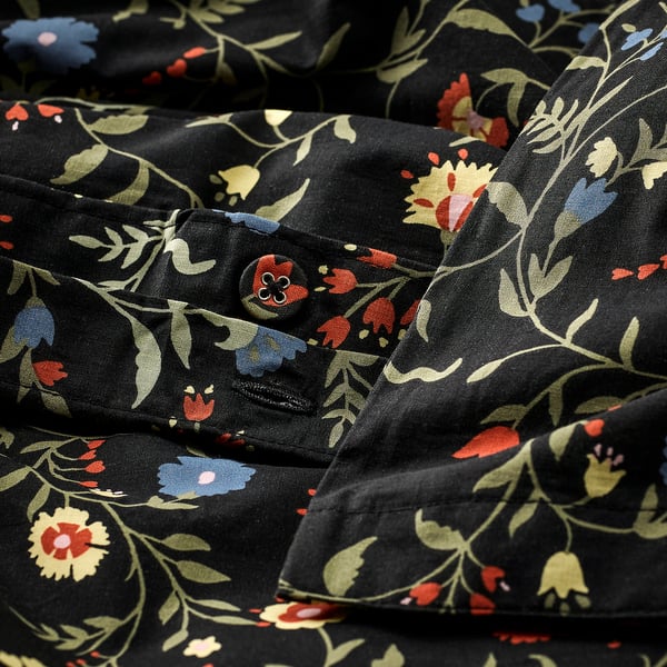 Floral duvet set. Black base with red, blue, yellow flowers. Organic cotton, breathable & comfortable.