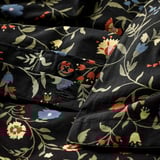 Floral duvet set. Black base with red, blue, yellow flowers. Organic cotton, breathable & comfortable.