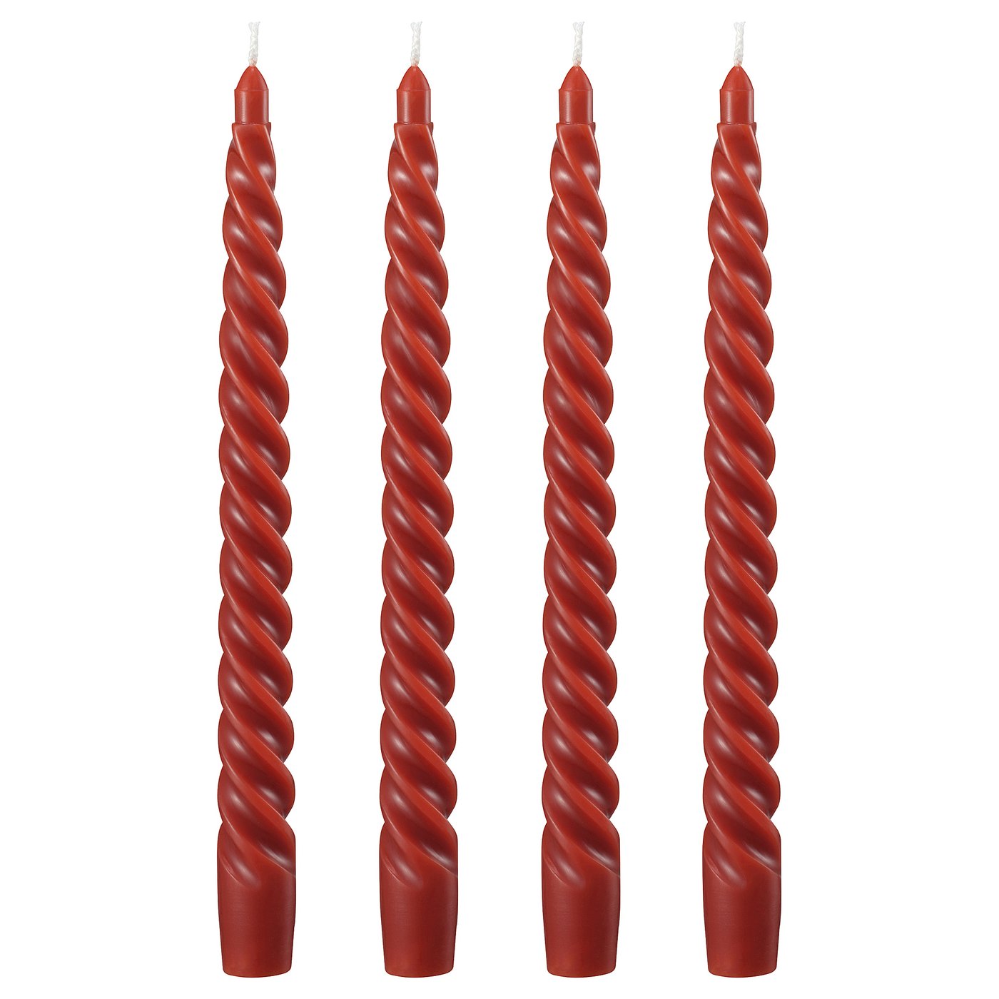 Four red spiral candles in a row, made of twisted red wax and cotton wicks.