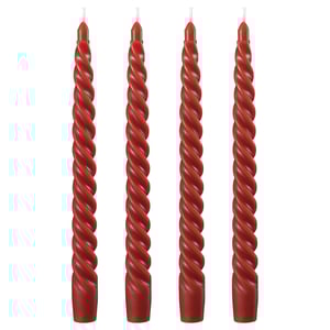 Four red spiral candles in a row, made of twisted red wax and cotton wicks.