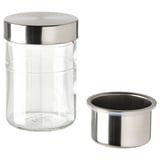 The DAGKLAR glass jar with a stainless-steel lid and insert, designed for storing food like oats or nuts.