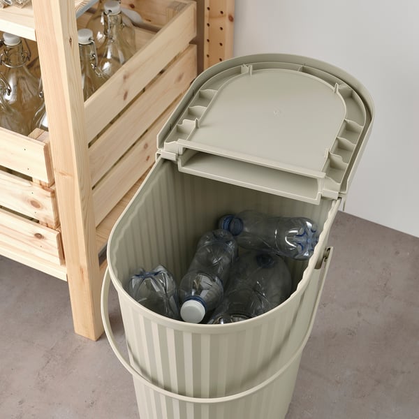 Large beige recycling bin filled with plastic bottles, part of the DAMMÄNG series, easy to carry with a folding handle.
