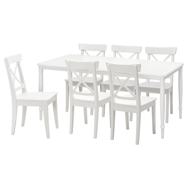 White square dining table with six matching chairs. Simple, clean design, ideal for small spaces.