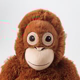 Plush orangutan toy, soft, detailed face, big eyes, friendly smile, made from polyester.