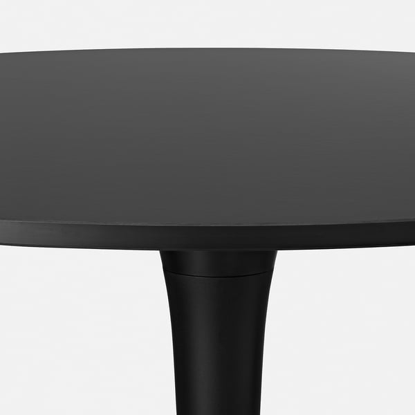Modern, sleek black dining table with sturdy metal base.