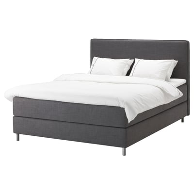 The DUNVIK bed is grey, rectangular with a padded headboard, featuring clean modern lines and a removable cover for easy washing.