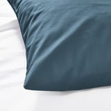 Close-up of a soft, blue DVALA pillowcase made of 100% cotton, showcasing its smooth texture.