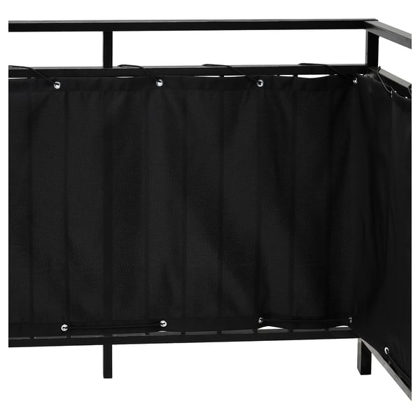 Black balcony privacy screen by DYNING with vertical panels and metal frame for wind and sun protection.