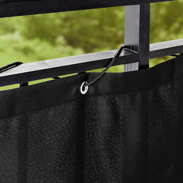 Black balcony privacy screen with ropes, attaching for wind and sun shield.