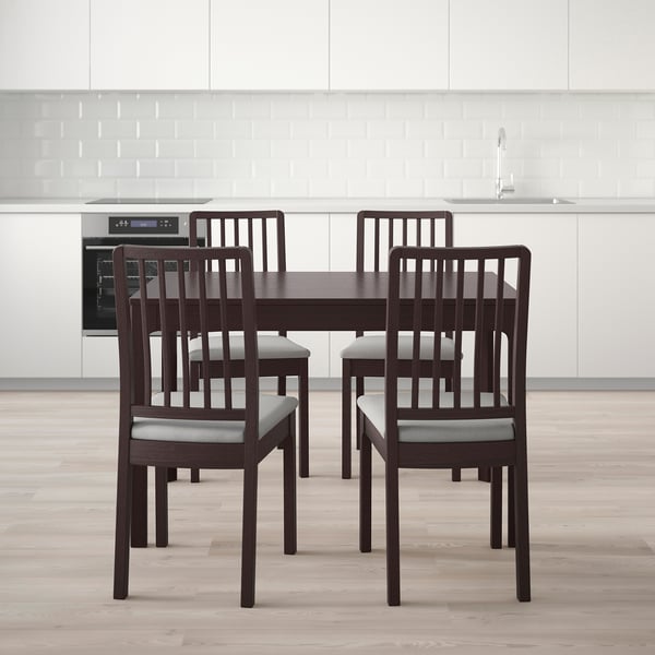 Modern dining set with extendable table and four padded chairs, ideal for small spaces.