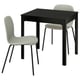 Black extendable dining table with 2 gray fabric chairs, curved backs.