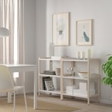 EKENABBEN white shelving with dishes, glasses, candles, books, and decor.