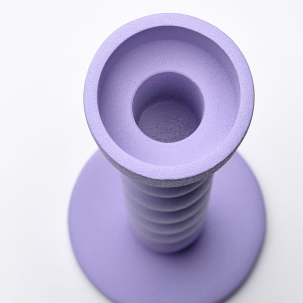 Purple modern candle holder, smooth texture, robust base, sleek design.