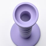 Purple modern candle holder, smooth texture, robust base, sleek design.