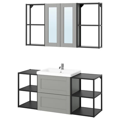 Modern grey ENHET bathroom vanity with open shelves and a mirror cabinet, combining style and functionality.