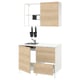 Modern kitchen setup with wooden fronts, white countertop, stainless steel sink, wall cabinets, and black accessories.