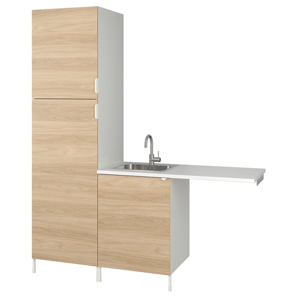 Modern light wood kitchen unit with sink and faucet.