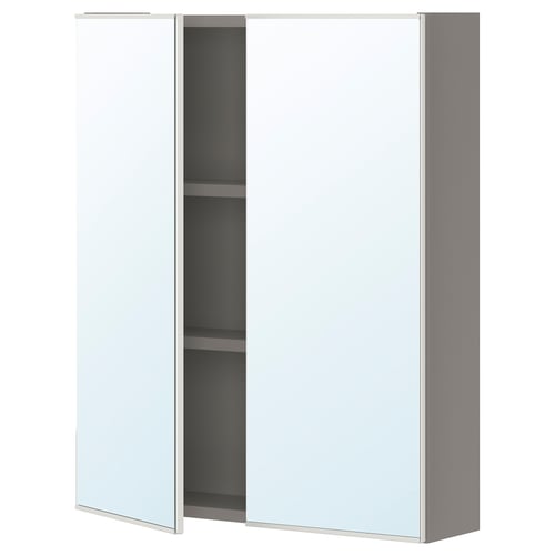 A white ENHET bathroom cabinet with mirrored doors. It sleek, modern design and two glass shelves.