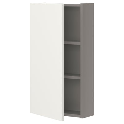 A white ENHET wall cabinet with two shelves. It has a sleek, rectangular design for storage in kitchens, bathrooms, or laundry rooms.
