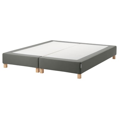 An ikea espevar bed base in gray, upholstered with fabric, featuring wooden legs and slats for mattress support.