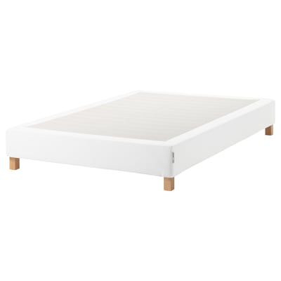 White espevar platform bed base with wooden legs.