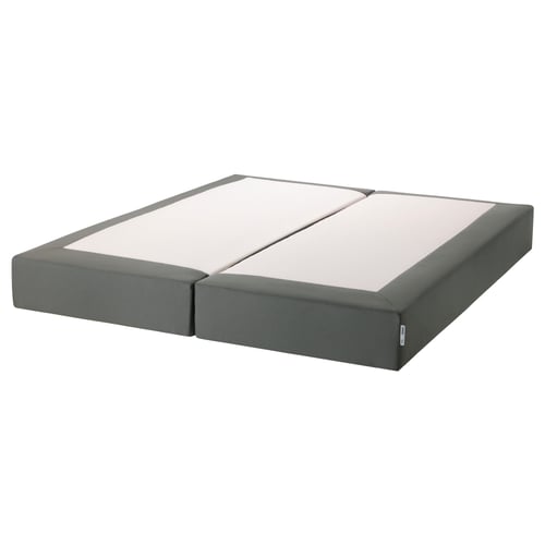 An ESPEVÄR grey mattress base, featuring upholstered sides and supportive springs, designed to elevate beds and enhance mattress support.