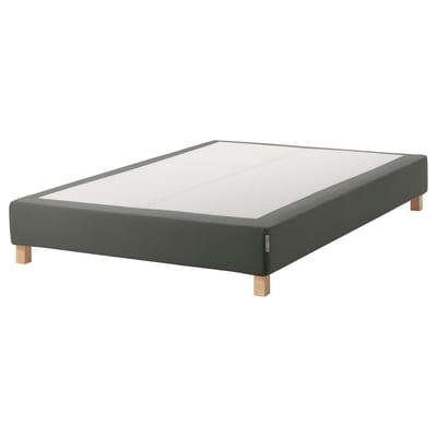 An ESPEVÄR gray mattress foundation with wooden legs and an upholstered base.