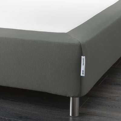 Gray upholstered bed frame with metal legs, upholstery zipper visible.