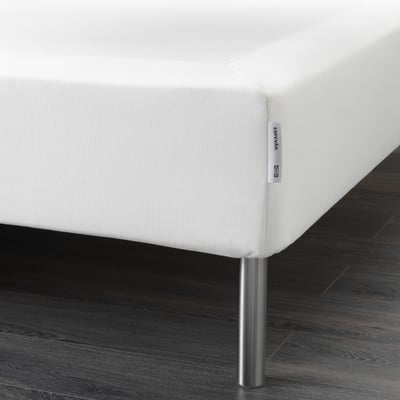 A modern bed base with stainless legs and a washable cover, raising and supporting mattresses.