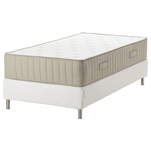 A white ESPEVÄR/VATNESTRÖM bed with a pocket-sprung mattress, featuring natural materials and a stainless steel base.