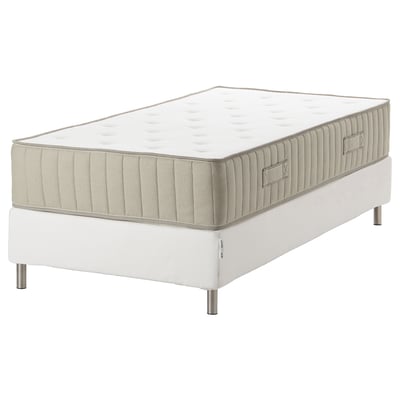A white ESPEVÄR/VATNESTRÖM bed with a pocket-sprung mattress, featuring natural materials and a stainless steel base.