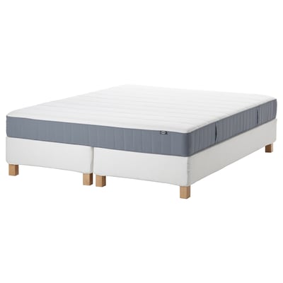 Mattress set with white and blue accents, modern design, wooden legs.