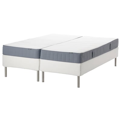 This image shows a white espevär queen-size mattress set with gray trim and stainless steel legs.