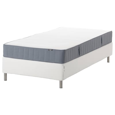 Sleeping on this modern white mattress, held by a sturdy white base. Grey edges add style to its cozy look.