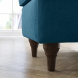 Teal bench with wooden legs.