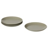 Image shows a set of four matte gray plates, three stacked and one individual, with a simple, modern design made from stoneware.