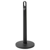 A black FAMILJ paper towel holder. It is tall with a circular base, made of polypropylene plastic, and has a loop at the top for carrying.