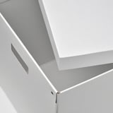 White box with cut-out handle, ideal for storage. Durable paperboard construction.