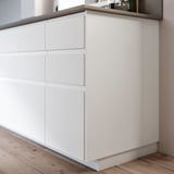 White FÖRBÄTTRA cabinet, 3 drawers, wood floor.